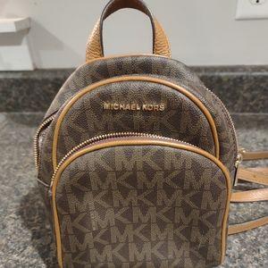 Michael Kors small convertible backpack.